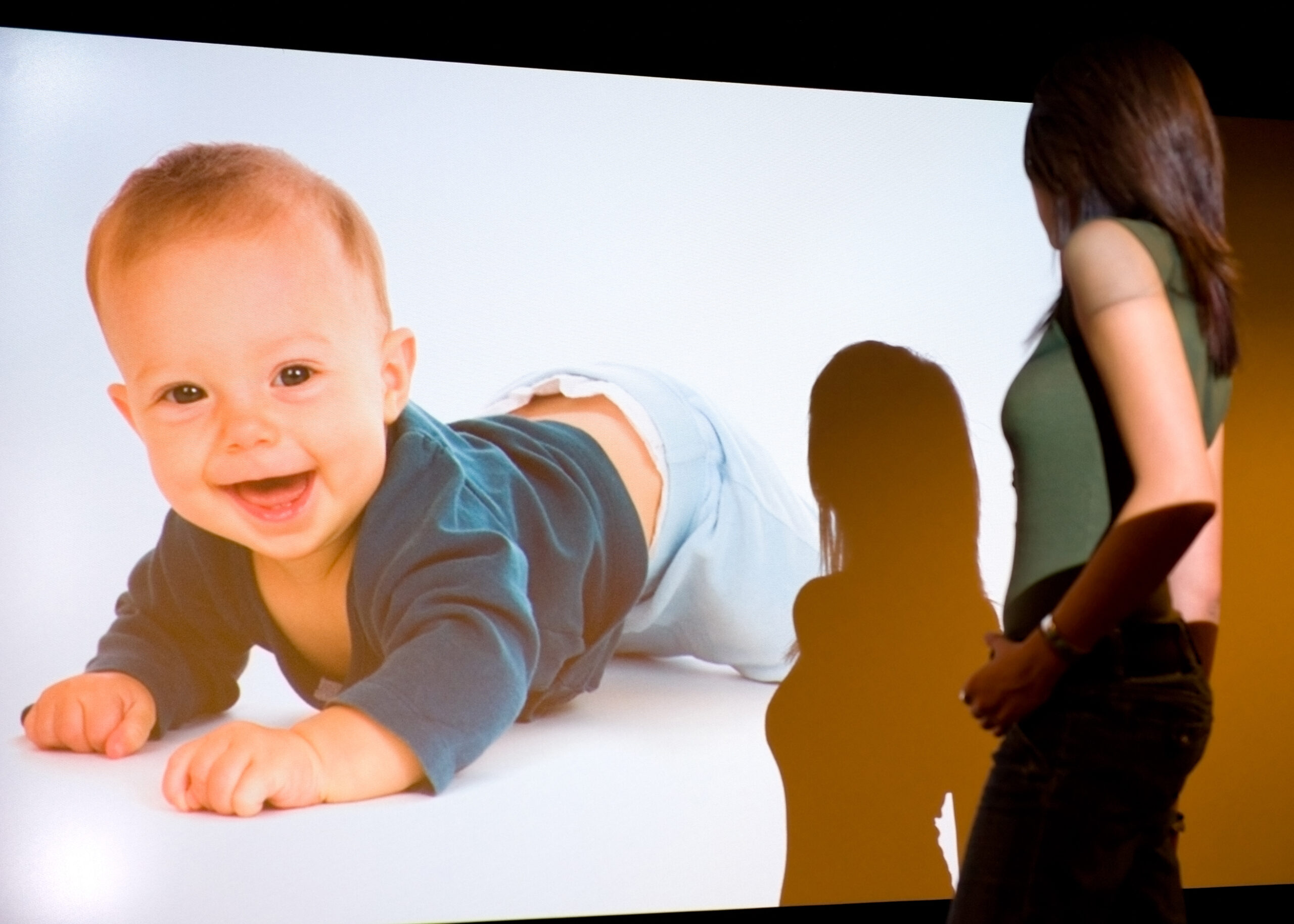 Client Examining Projected Baby Image