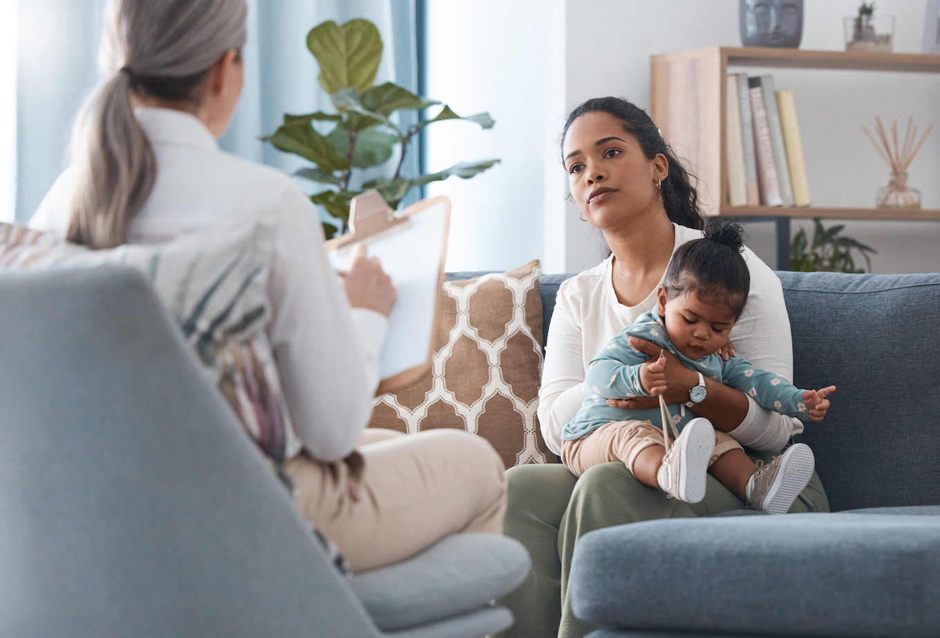 Shot of an attractive young woman sitting with her daughter during a consultation with a psychologist
