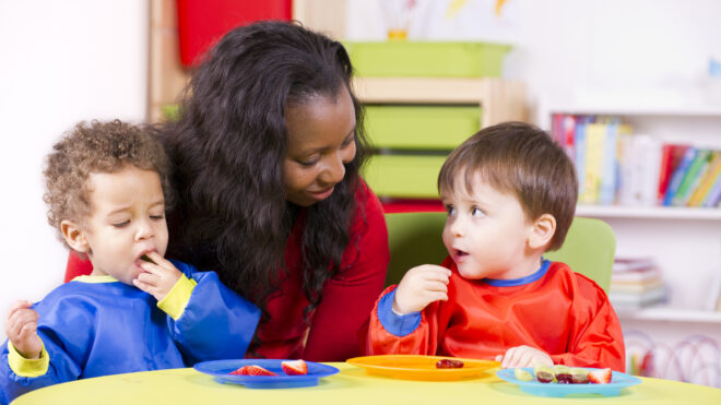 Kids with teacher in preschool