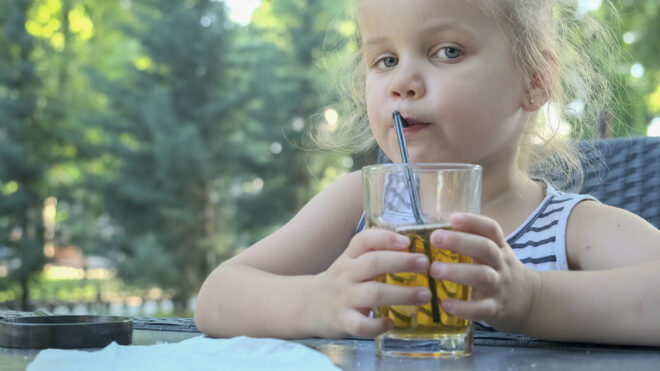 girl drinking apple juice