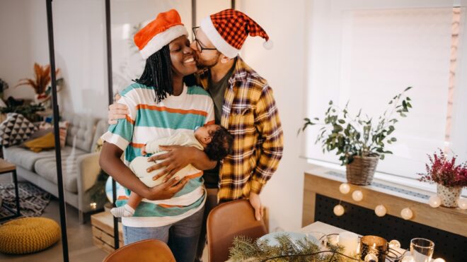 couple and baby at Christmas