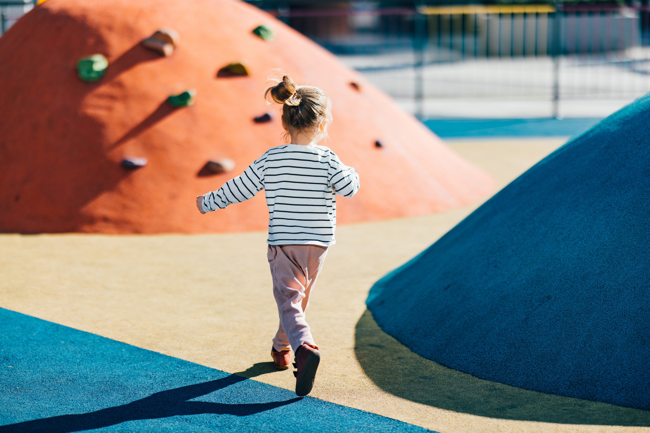 little girl playing on playground