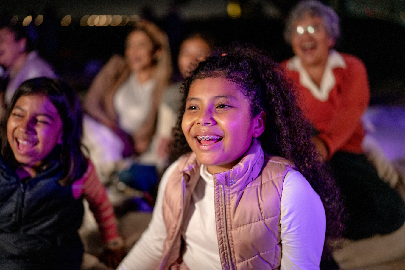 Girl watching a movie at the outdoors cinema