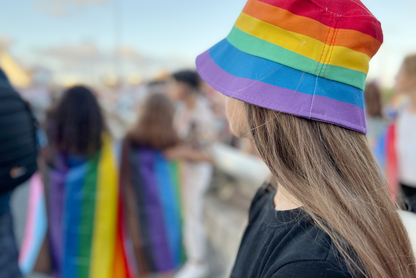 lgbt teenager girl wearing rainbow colors to support Pride parade.