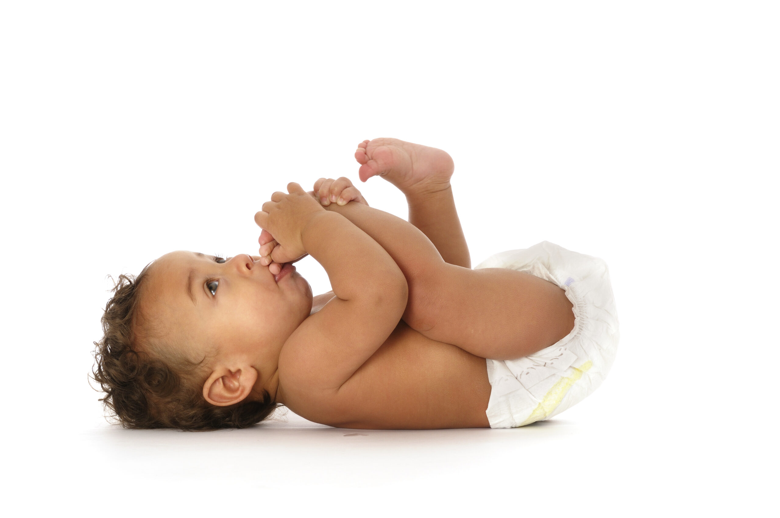 Biracial Baby Sucking his Toes Isolated on white