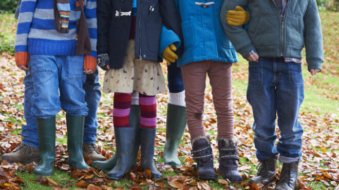 four kids standing together