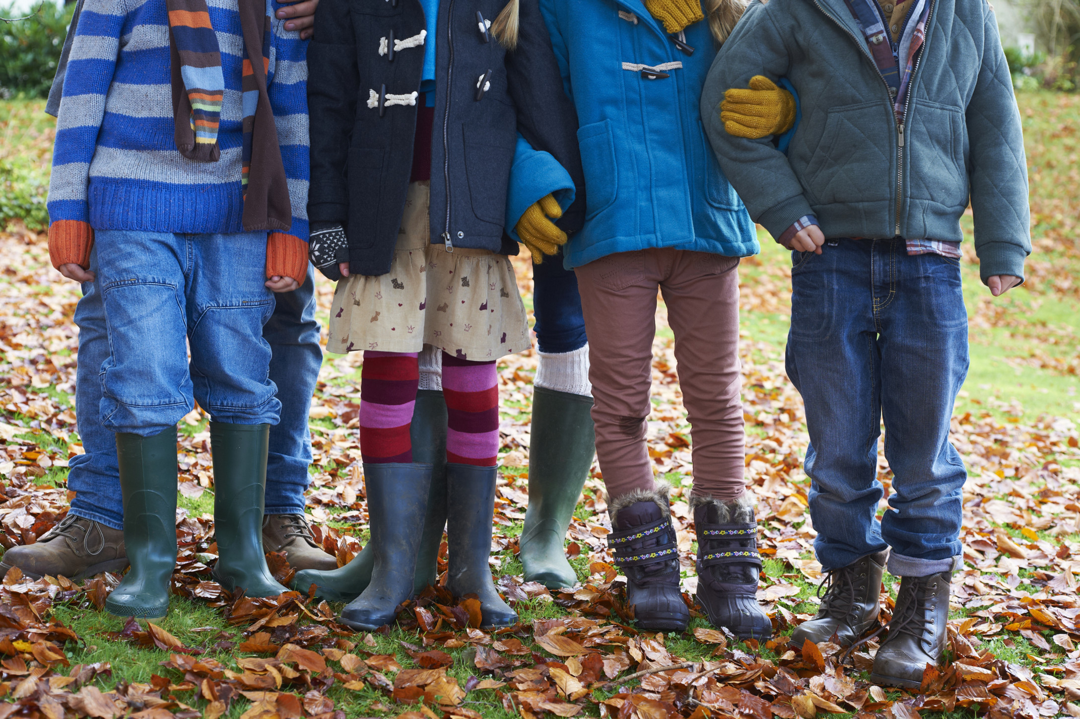 four kids standing together