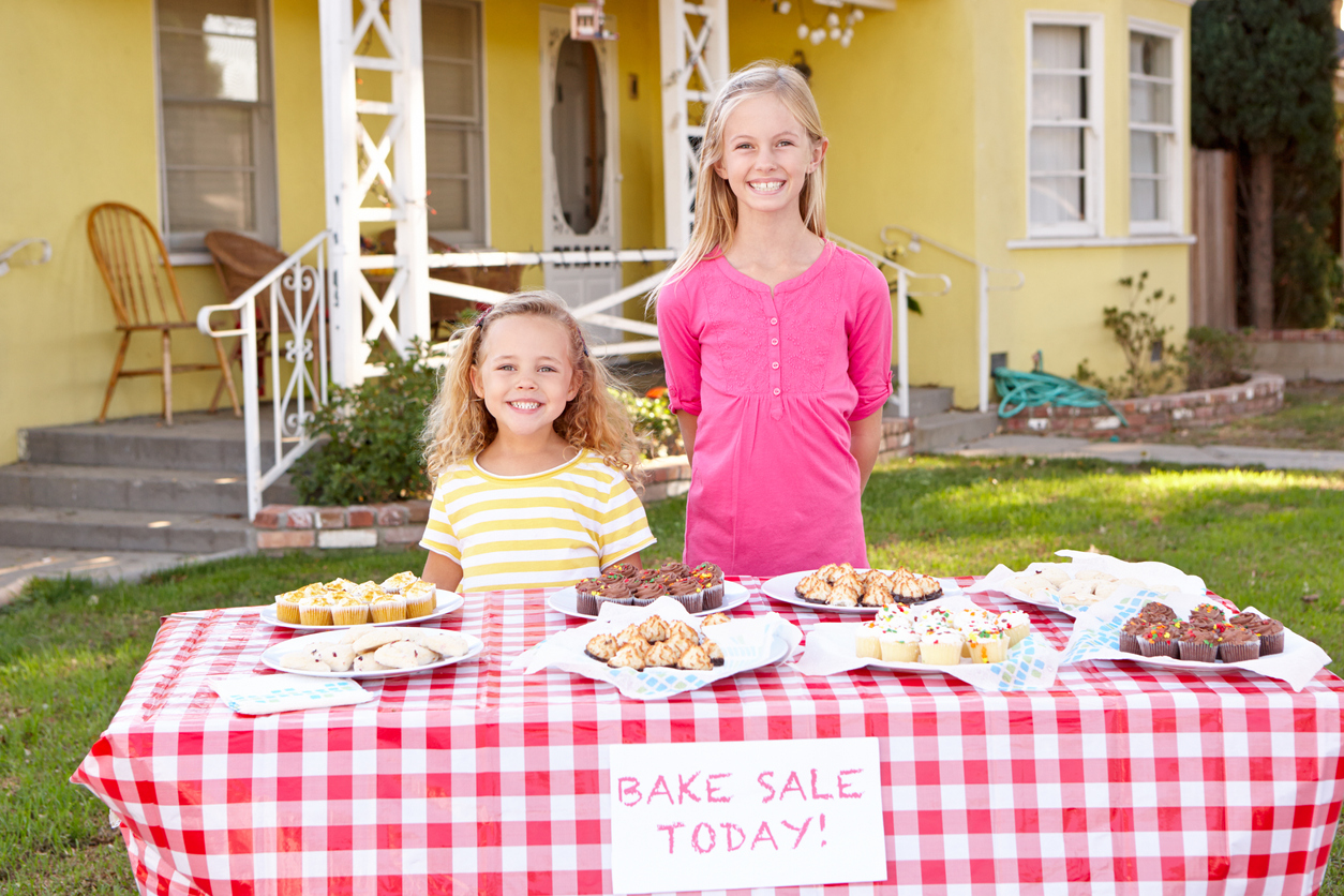 Children Running Charity Bake Sale