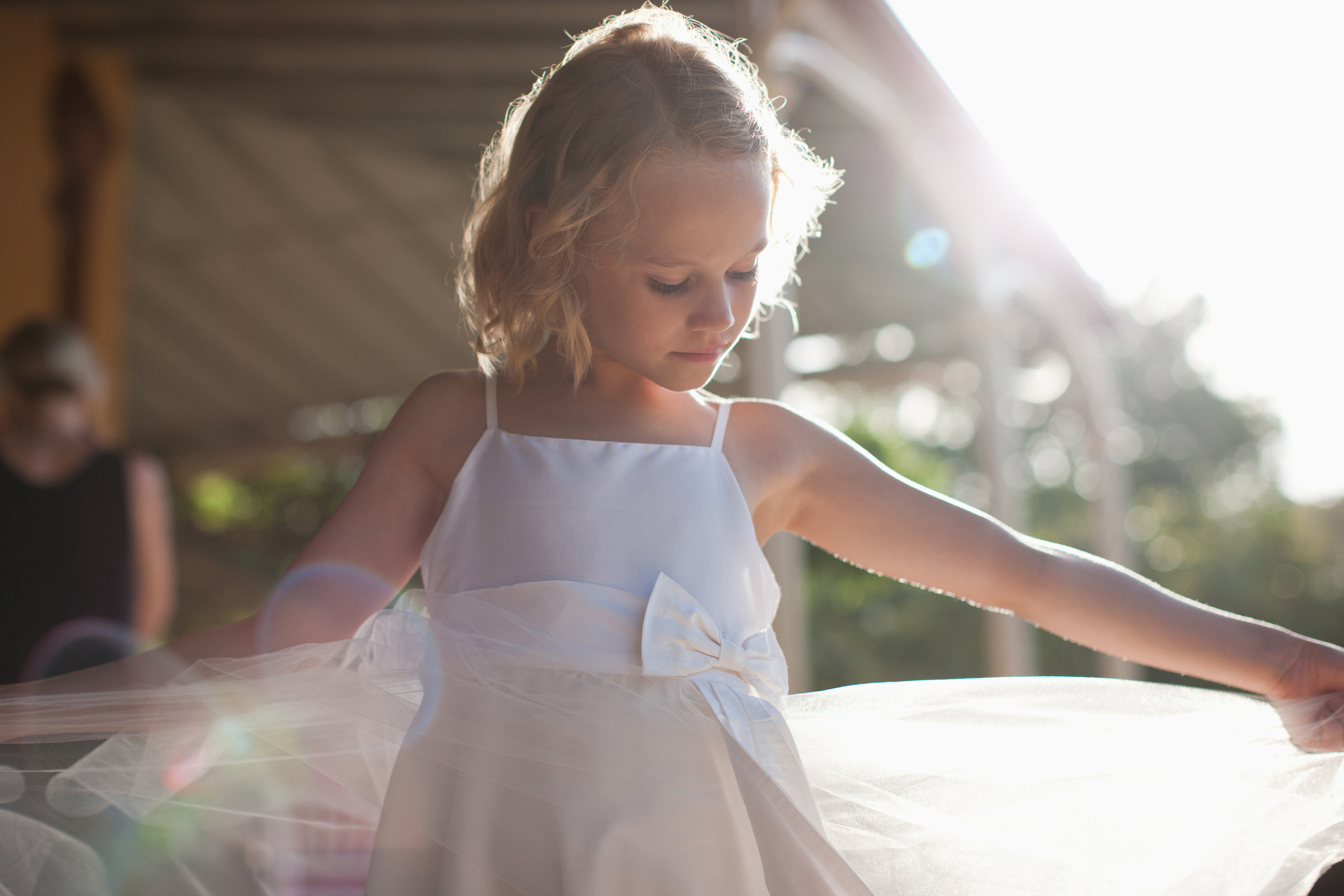 Flower girl with arms outstretched