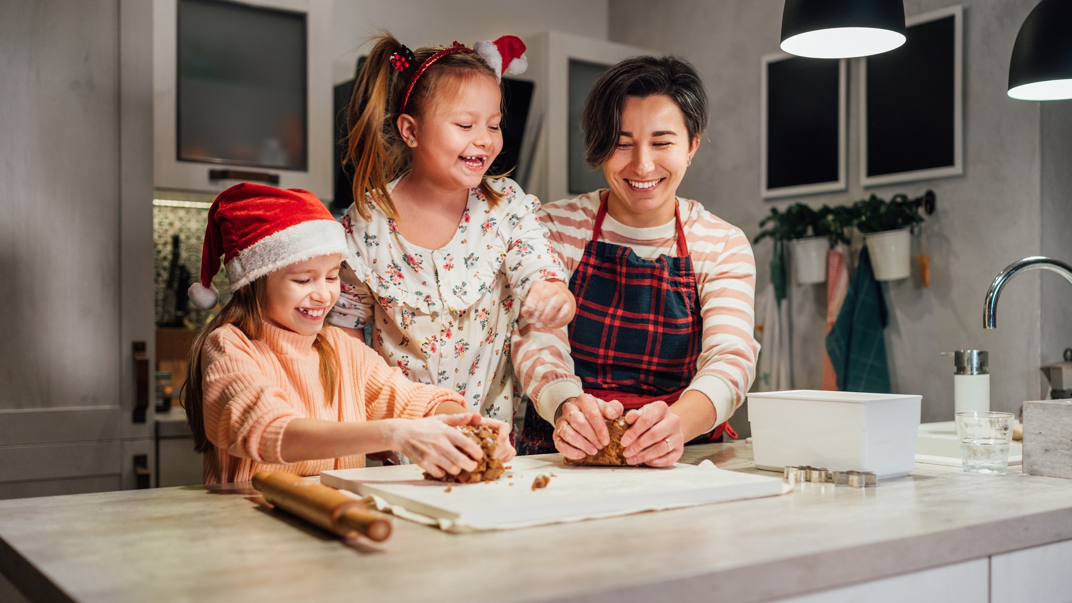 mom and two kids in kitchen