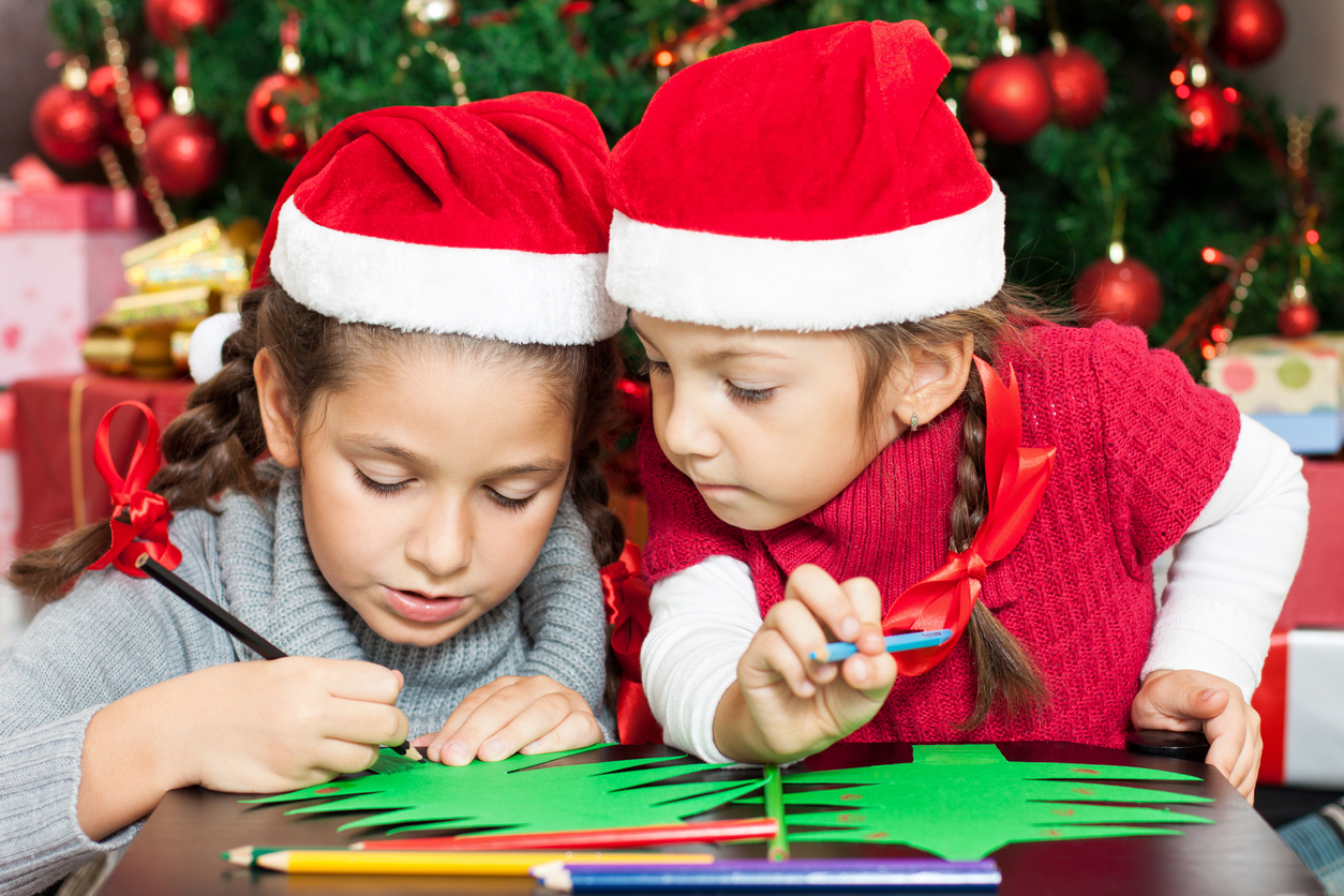Two Beautiful Sisters making Christmas cards