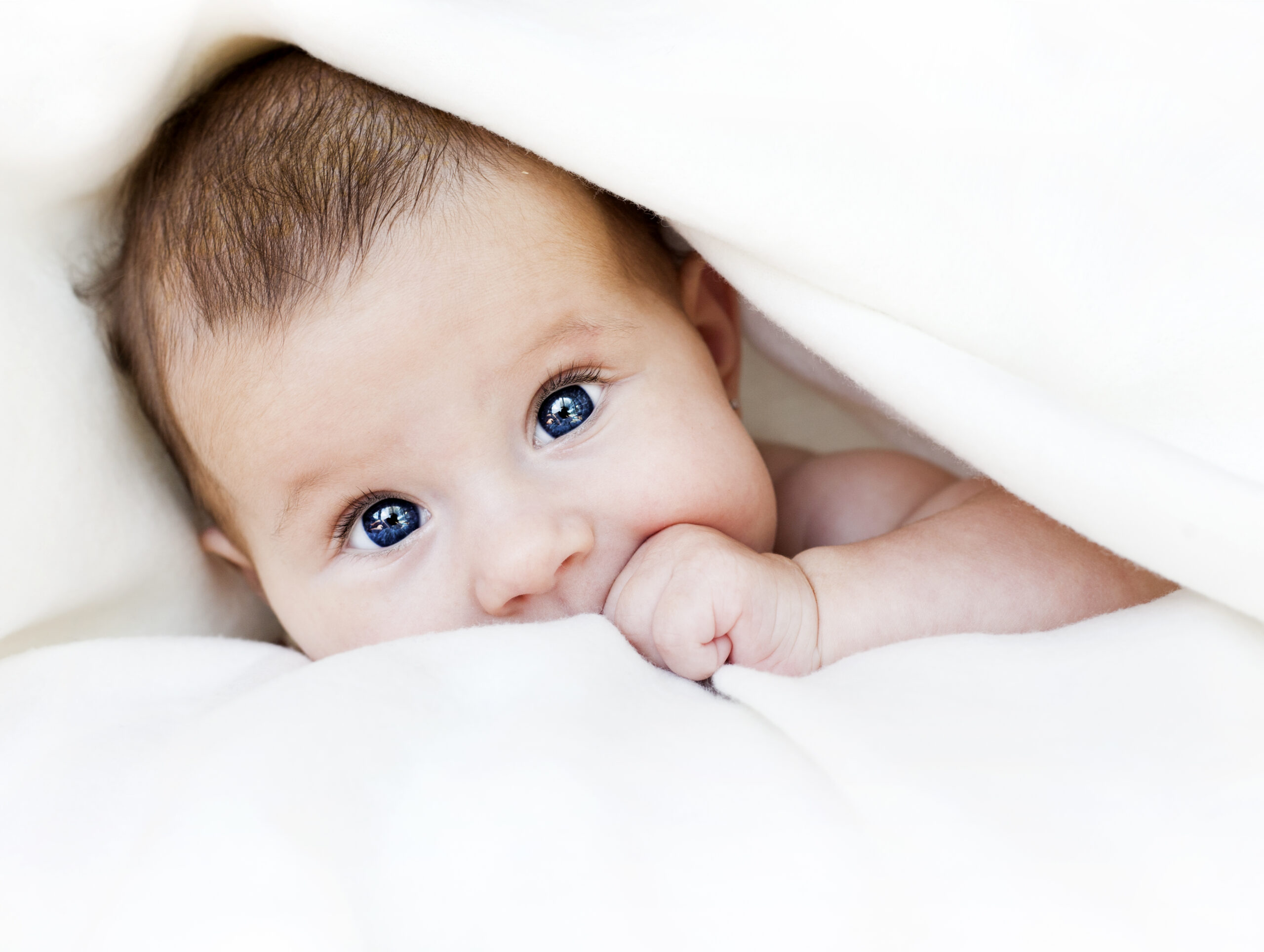 baby under blanket