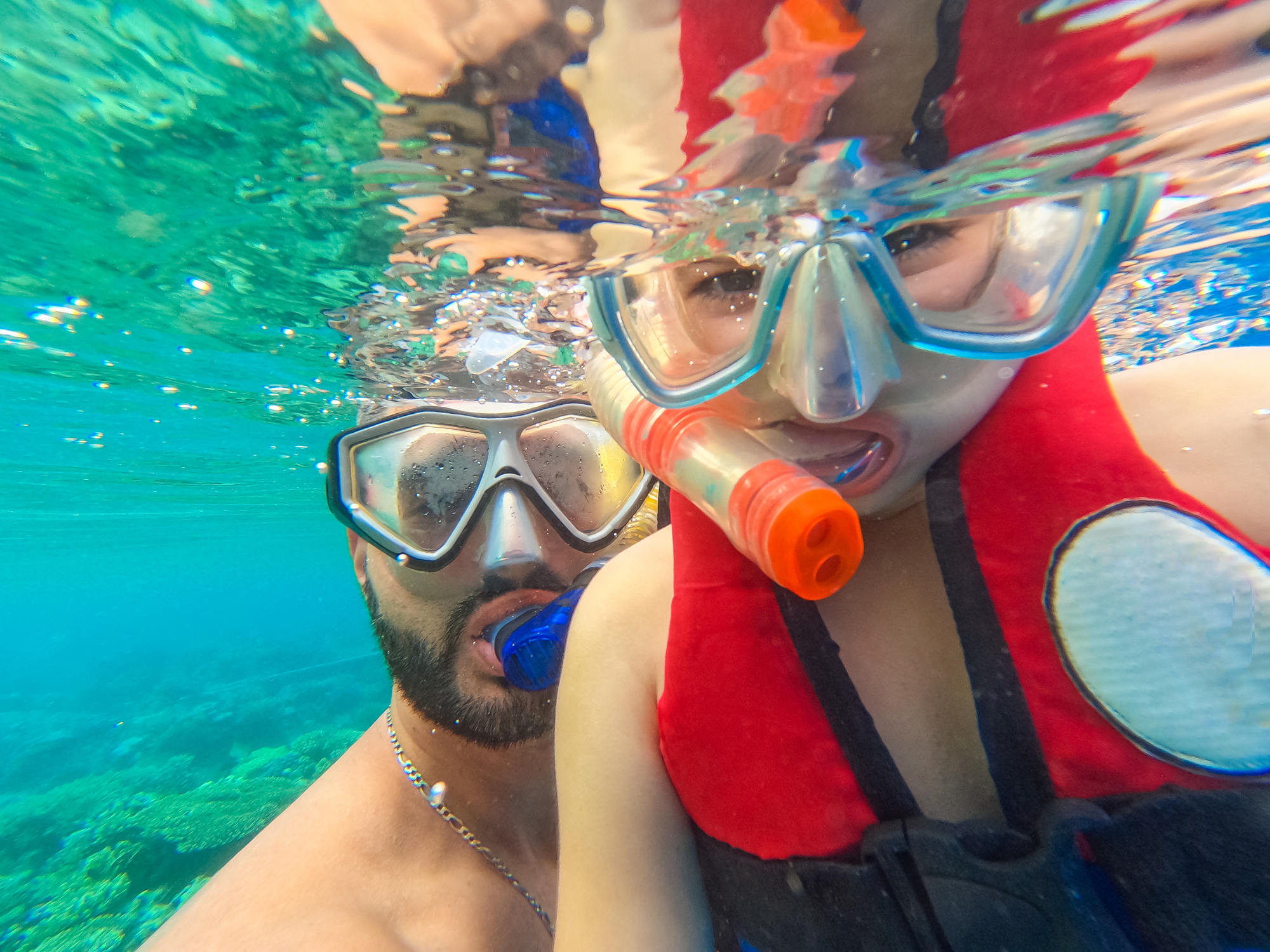 Young Father Taking A Selfie With His Daughter While Snorkeling In The Red Sea In Egypt