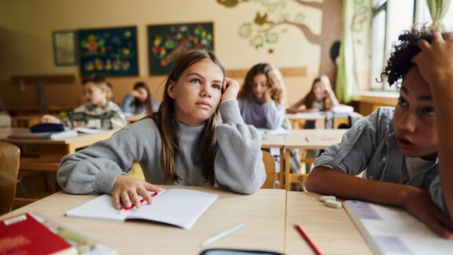 girl in classroom school bored spring fever