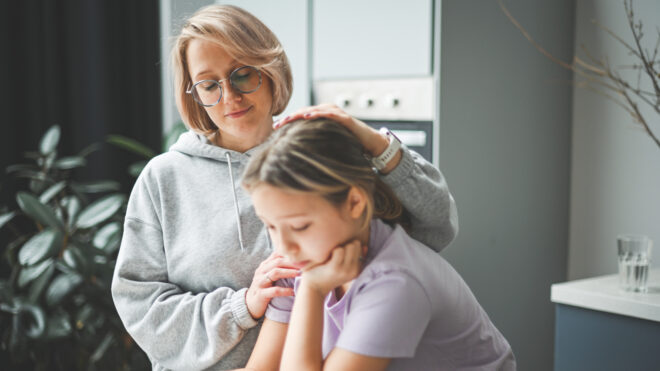 Concerned mom looking at daughter