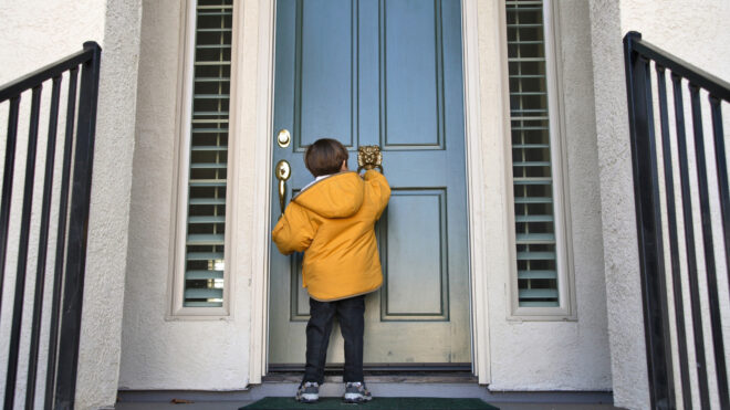 child knocking on door