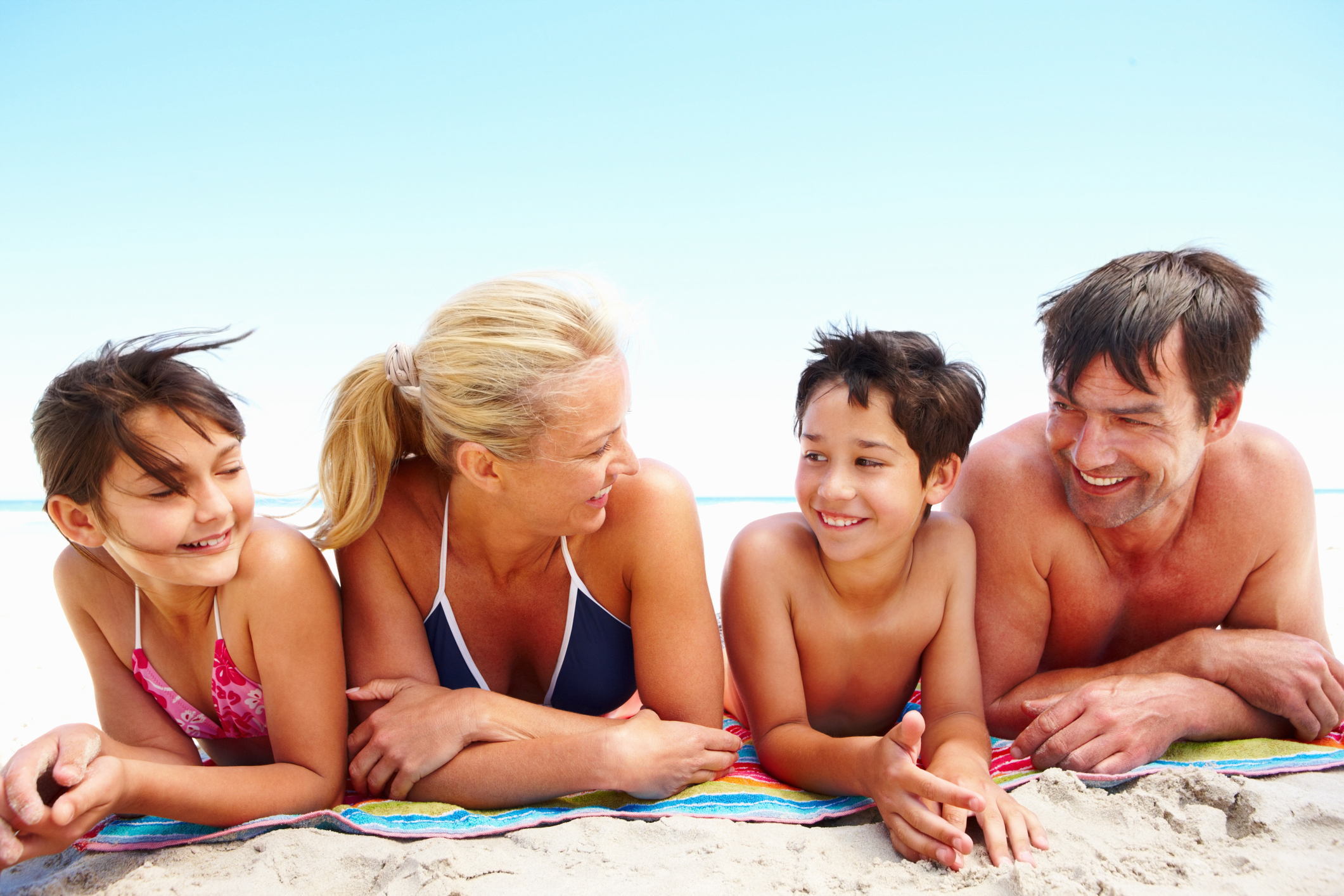 Family enjoying each other on the beach