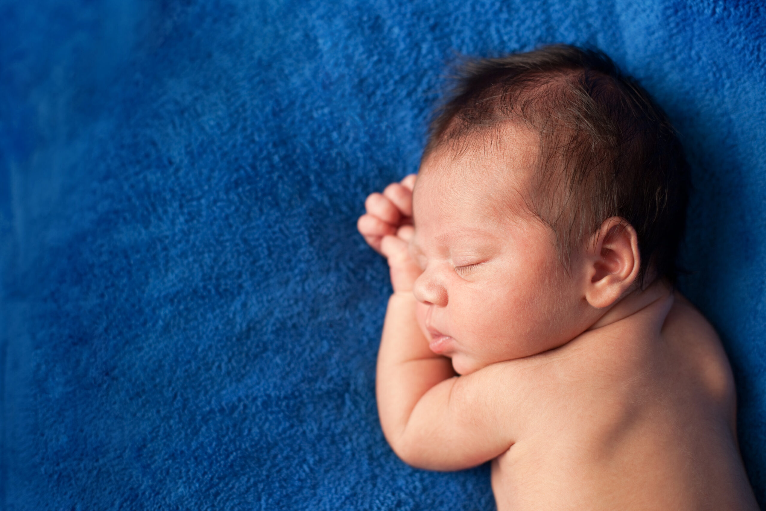 Color Image of Baby Boy Sleeping Peacefully, With Copy Space