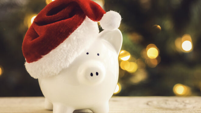 piggy bank wearing a santa hat