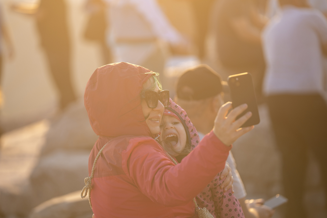 Photo of mother and daughter taking selfie on Nemrud Dagh