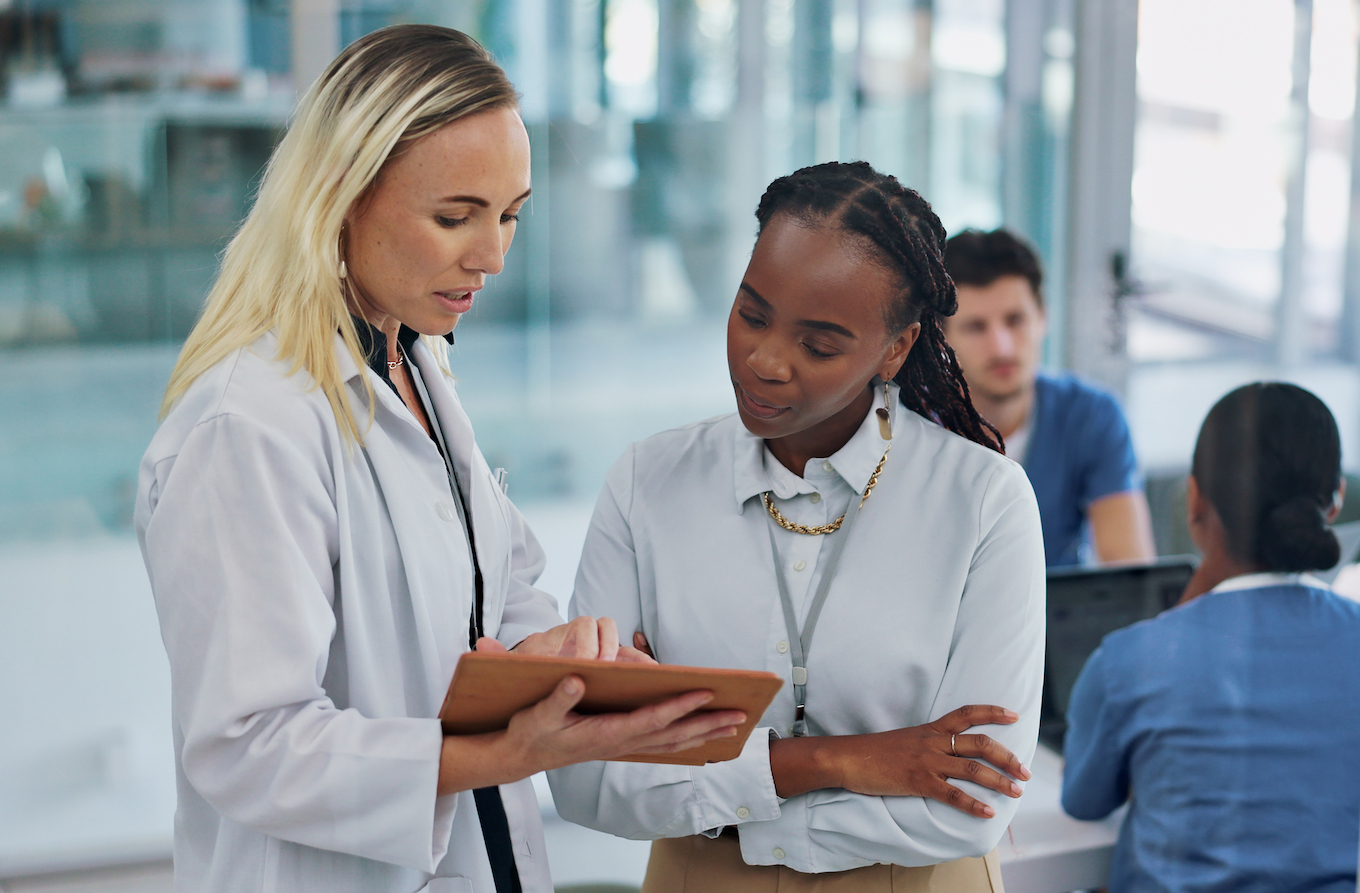 Doctors, healthcare and conversation in meeting, medical advisor and consultant for medicare insurance. Brainstorming, ideas and planning schedule for hospital and clinic with discussion and chatting