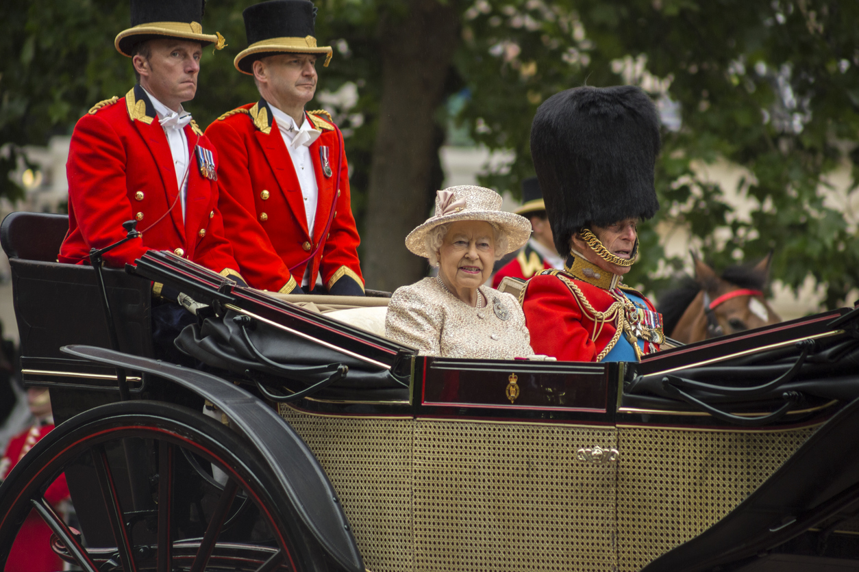 Queen Elizabeth II in an open carriage with Prince Philip