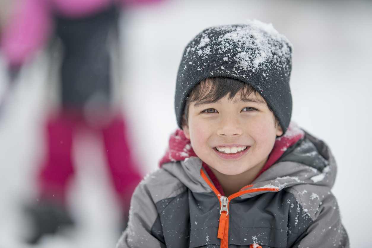 Little Boy Playing in the Snow