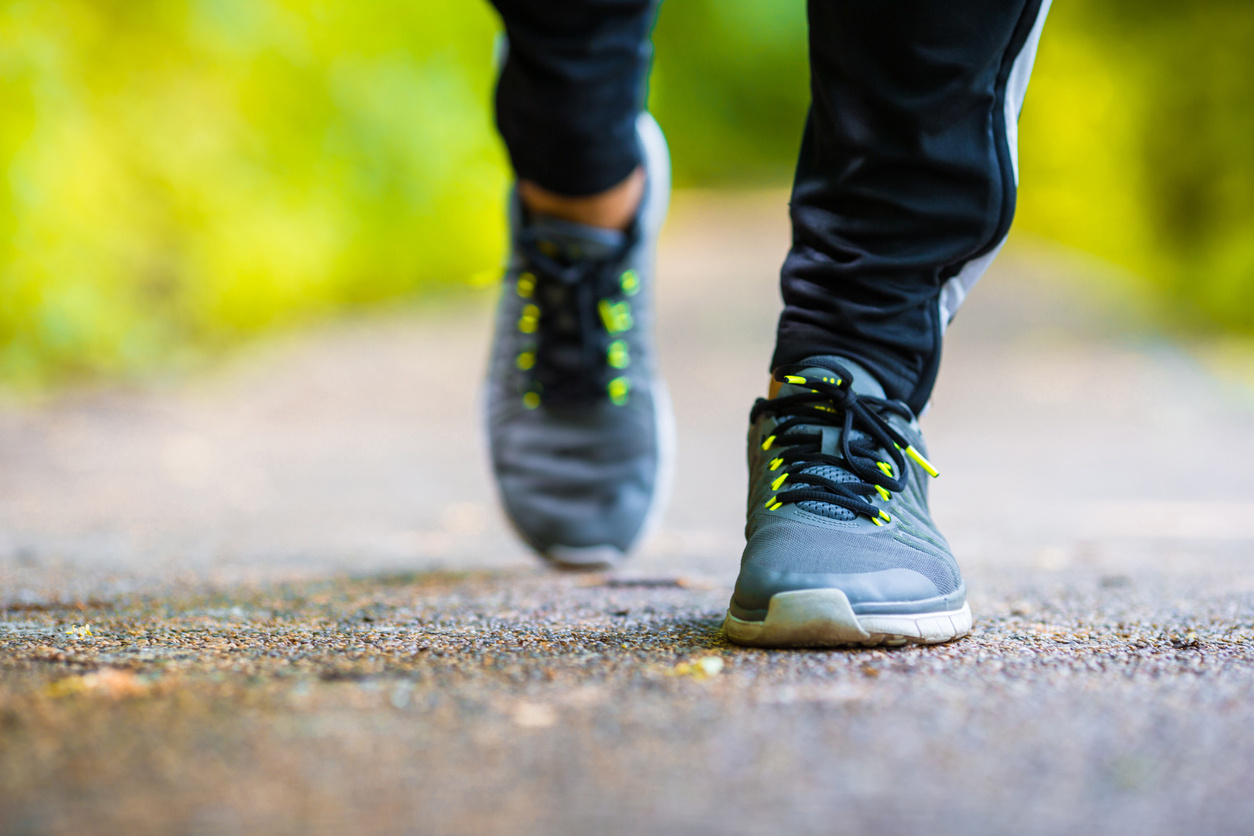 Close-up on shoe of athlete runner man feet running