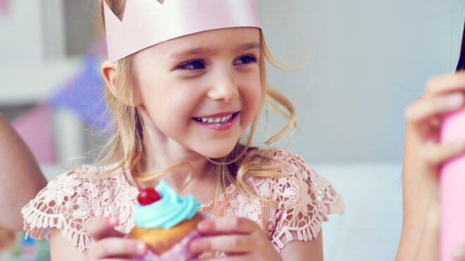 birthday girl eating cupcake