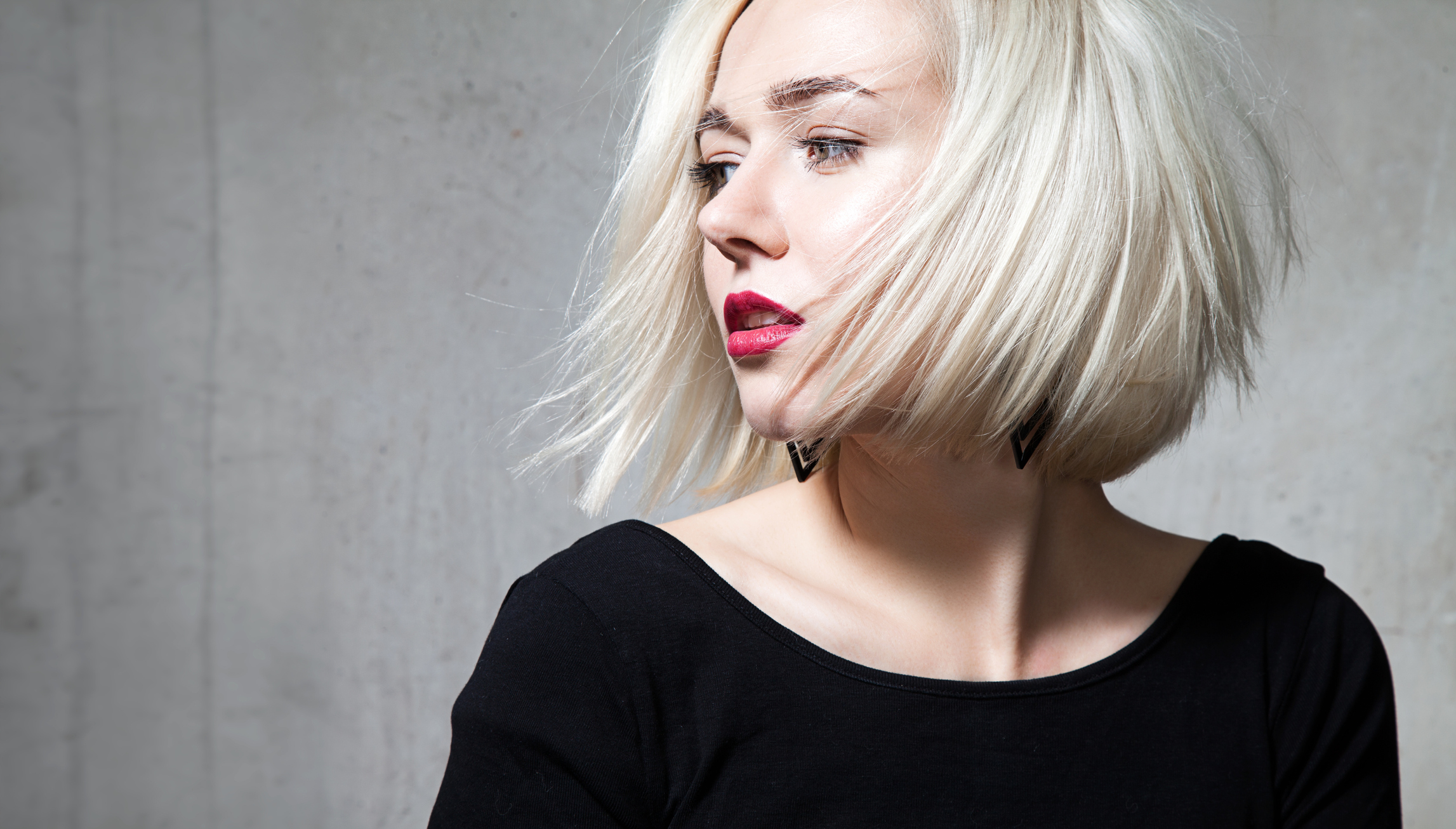 Close-up portrait of a beautiful blonde with red lips