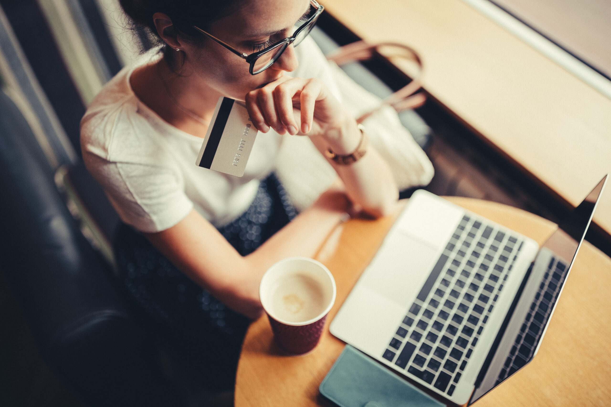 woman looking at laptop woman looking at laptop