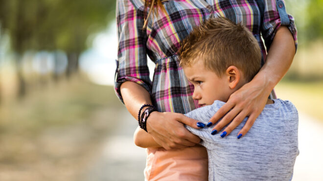 boy hugging mom