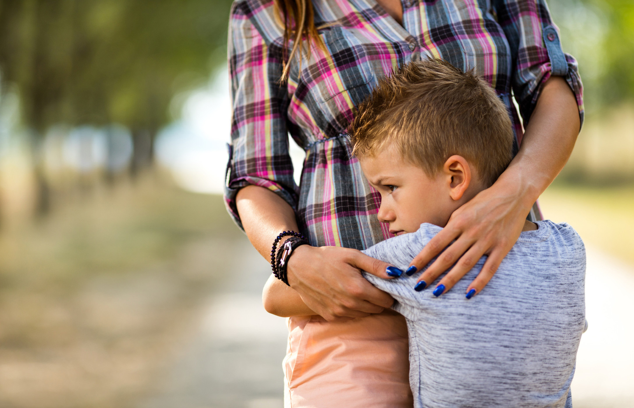 boy hugging mom
