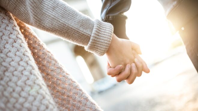 Couple holding hands
