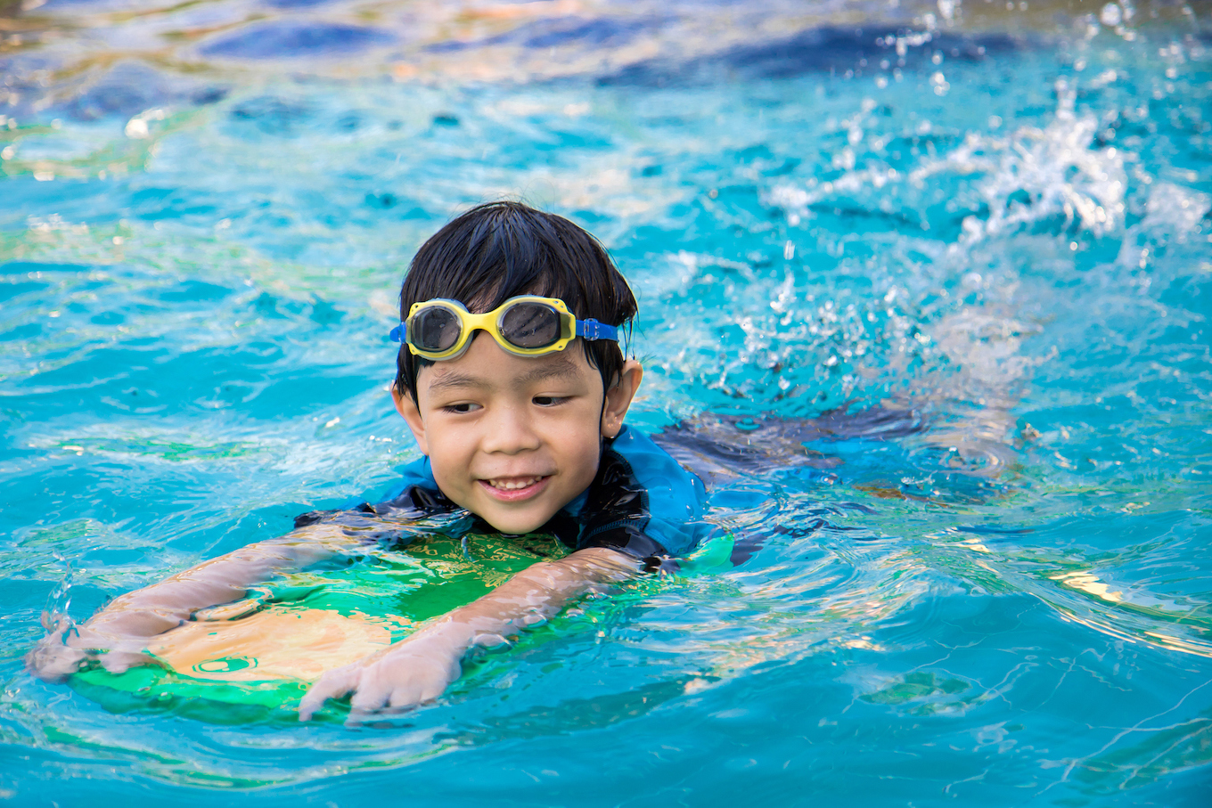 Child swimming in pool