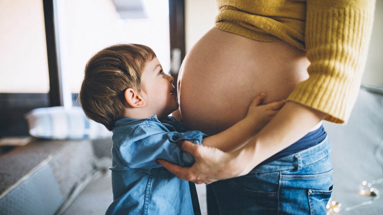 Mom holding a baby bump