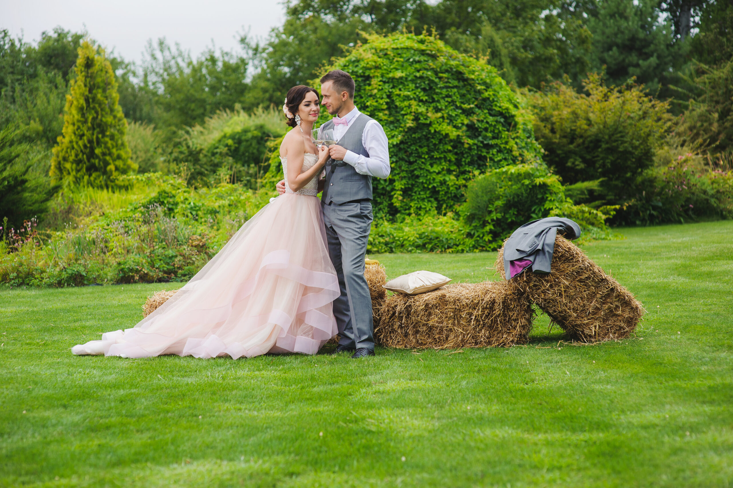 Bride and groom holding wine glasses