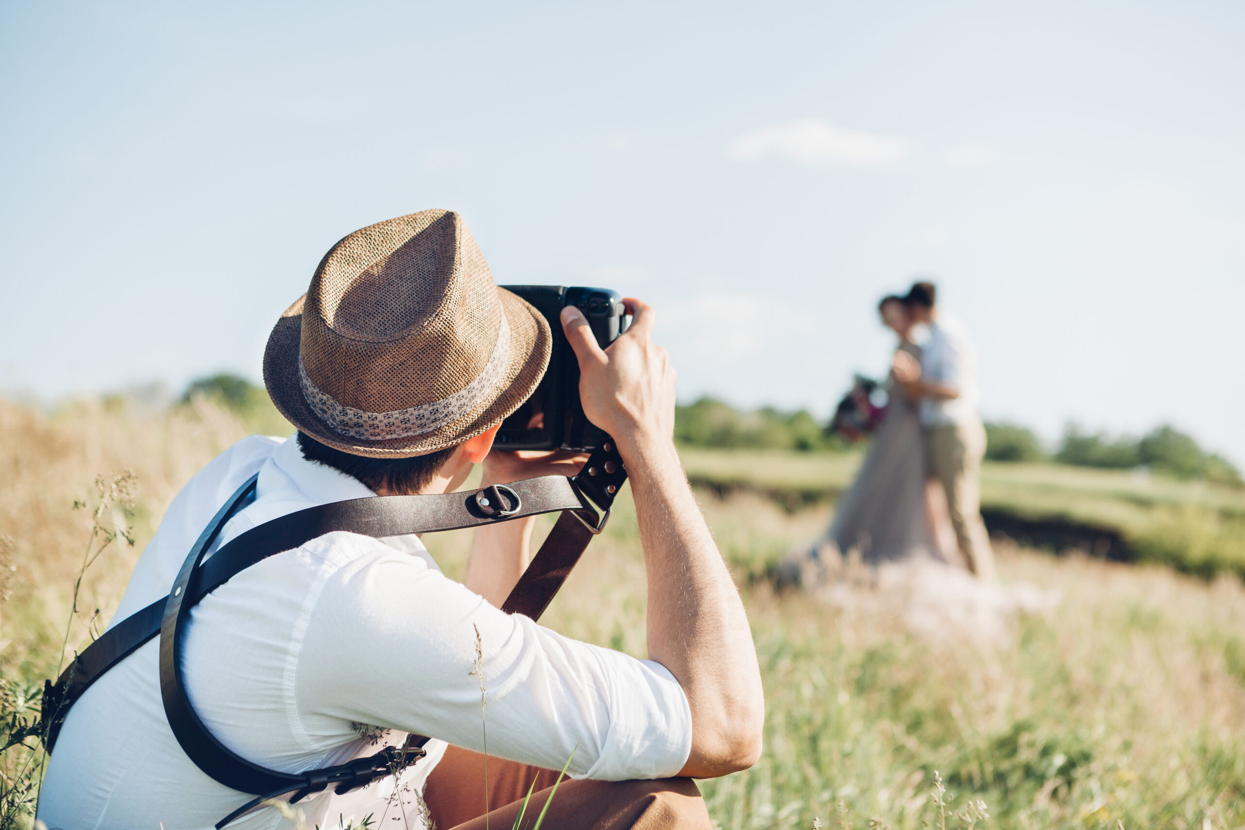 wedding photographer takes pictures of bride and groom in nature, fine art photo