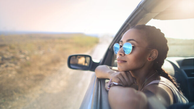 woman in car with braids