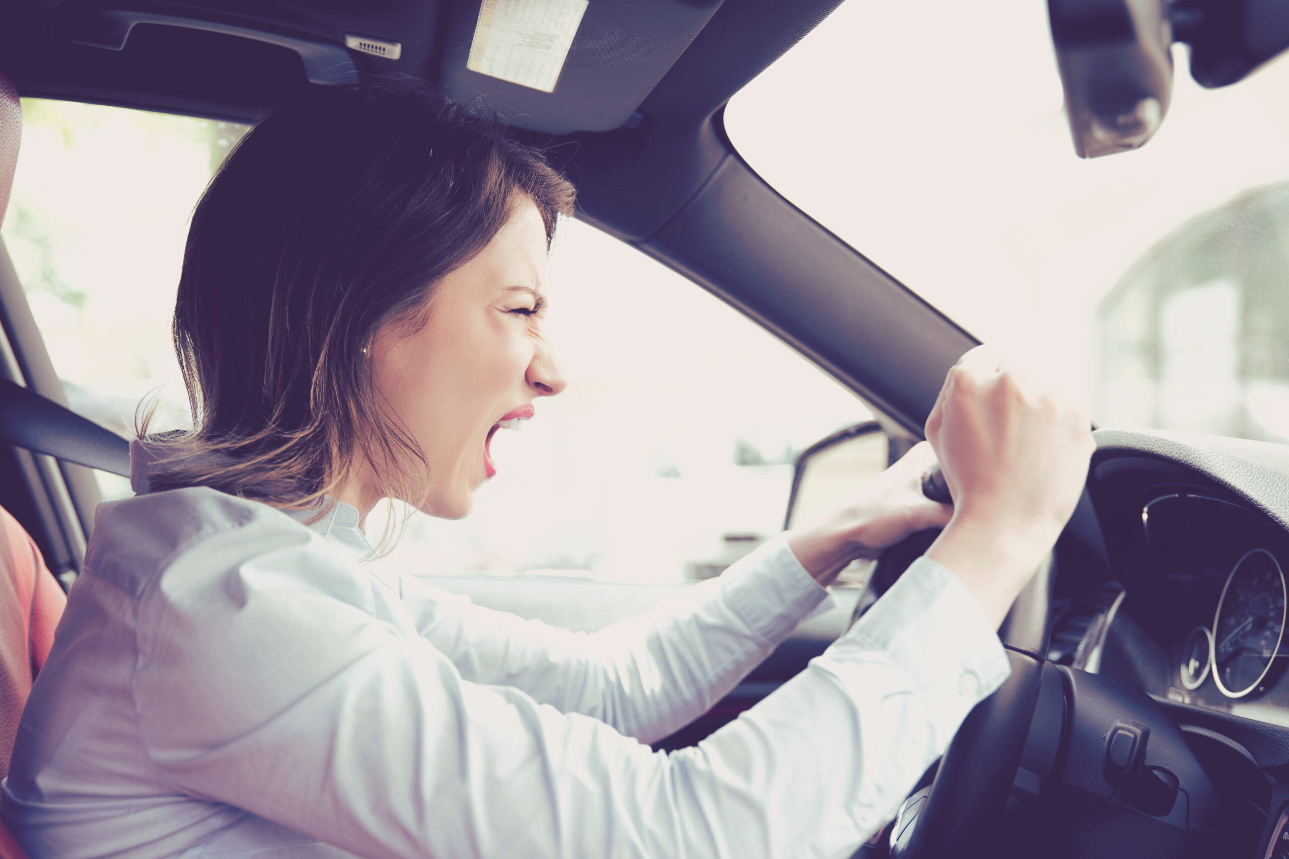Side profile angry female driver. Negative human emotions face expression