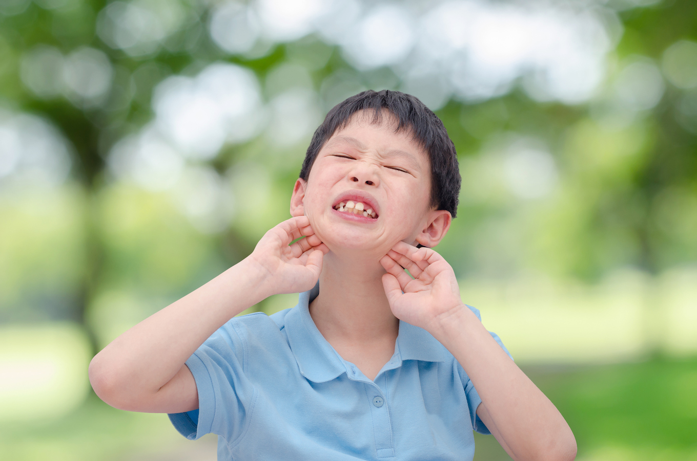 child scratching skin with rash