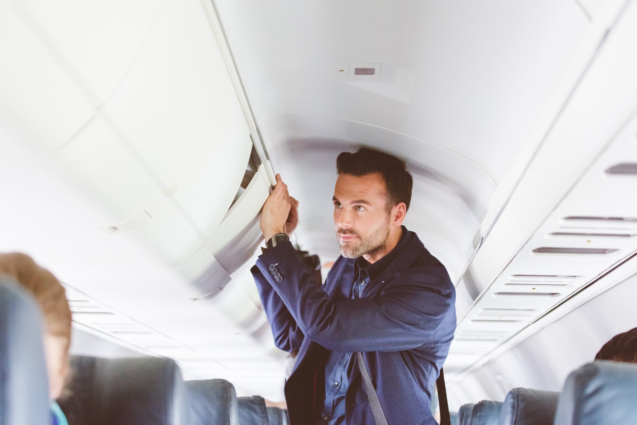 man standing on airplane