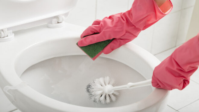cleaning a toilet