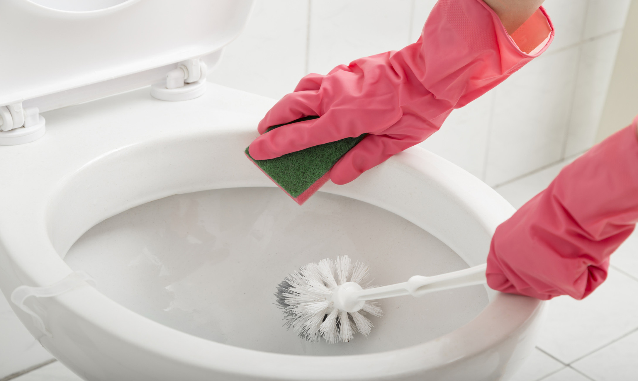 cleaning a toilet