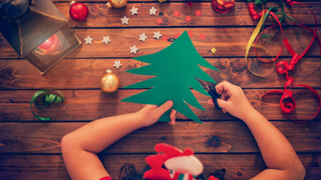 child doing christmas crafts