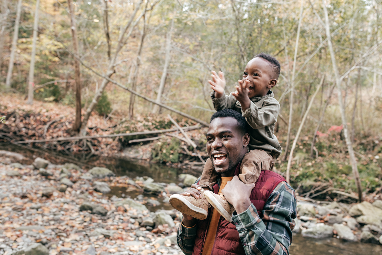 BEst dad holding son on shoulders