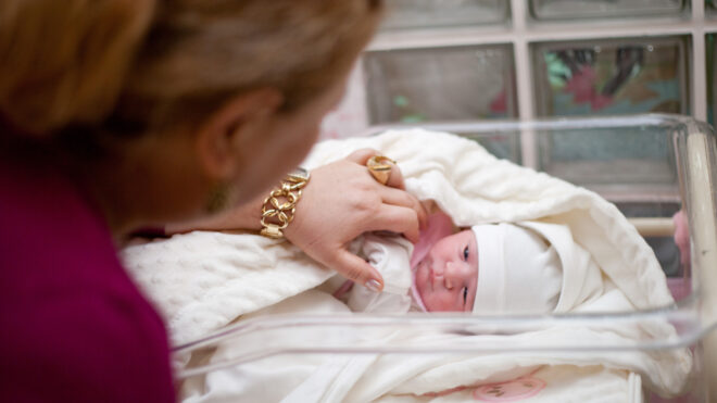 Grandma visiting newborn