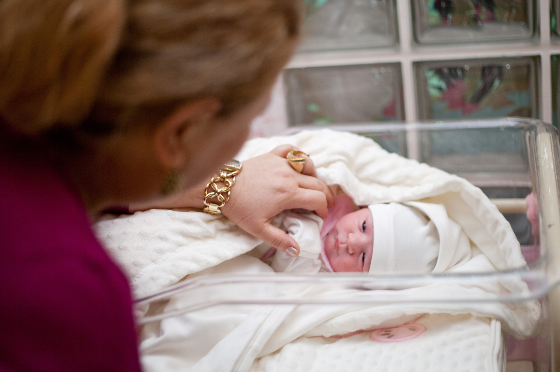 Grandma visiting newborn