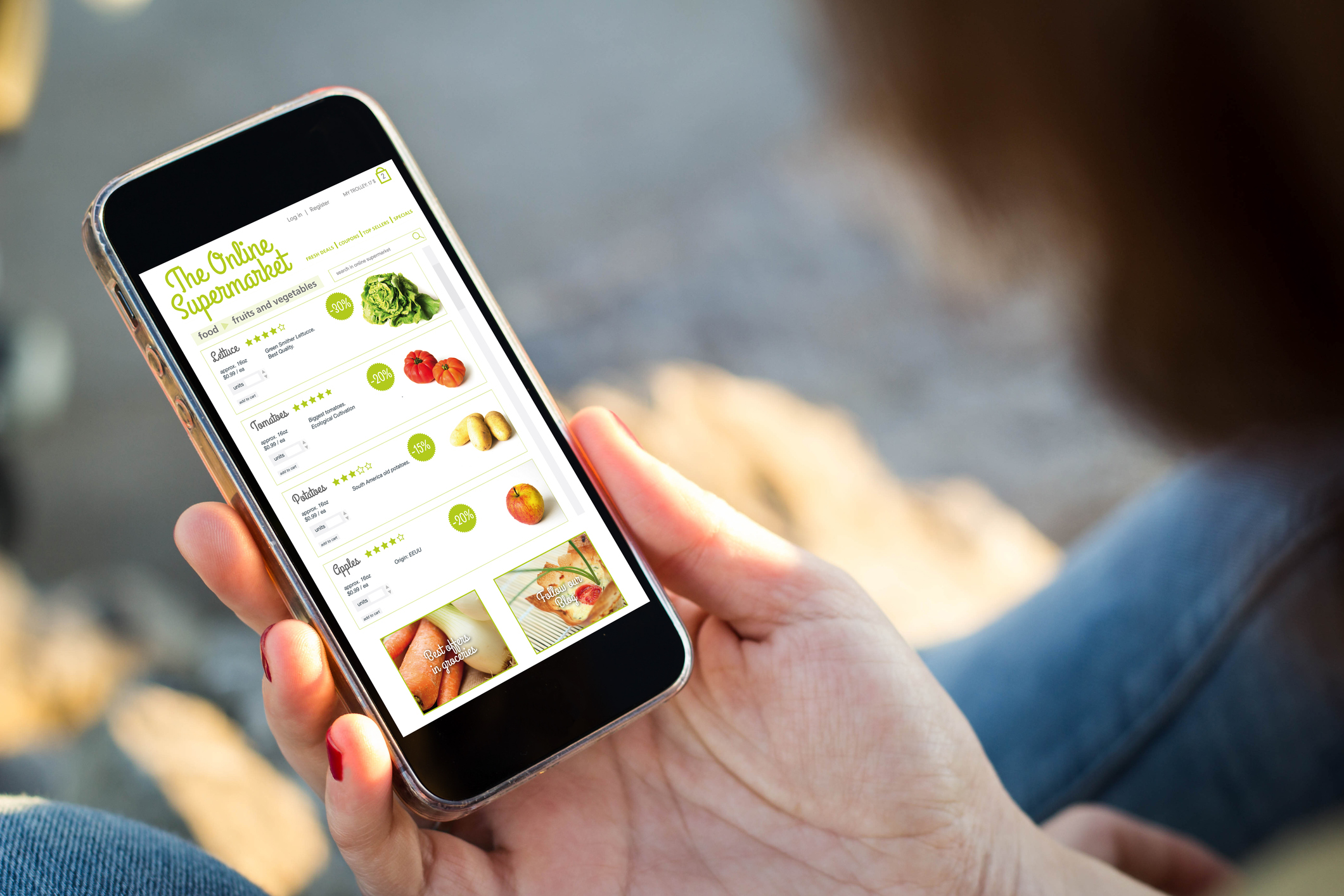 woman sitting in the street shopping groceries with her smartphone