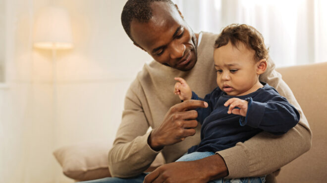man holding toddler